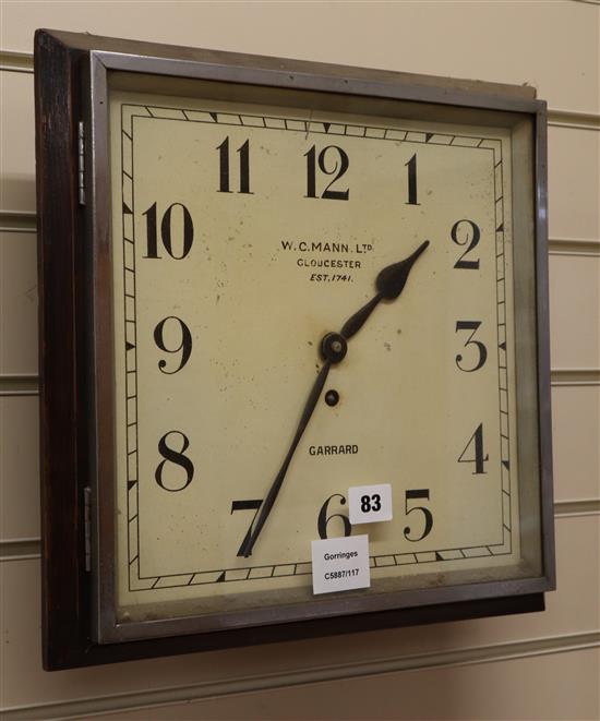 A W.C. Mann wall clock, dial 32cm square